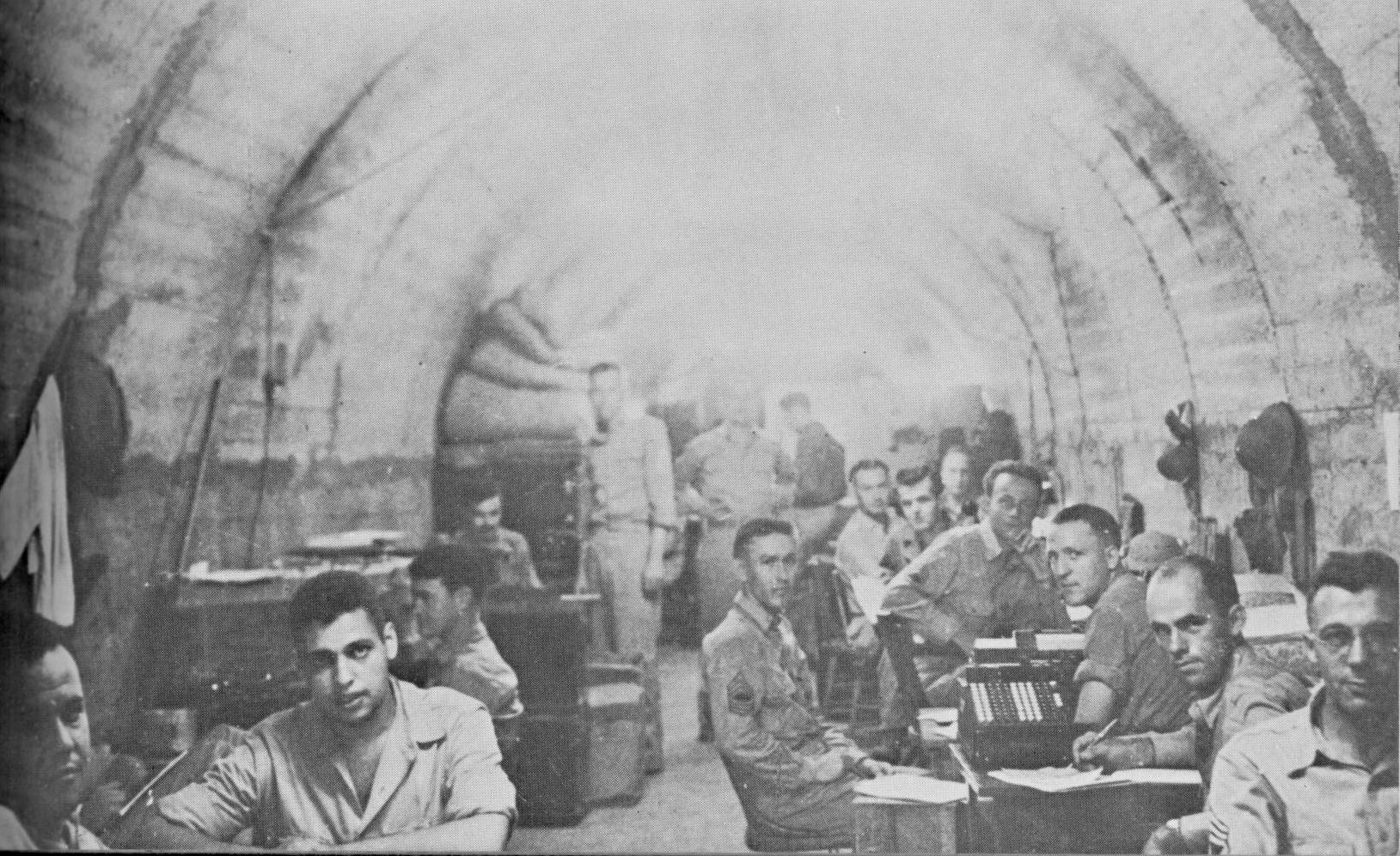 A candid shot of men in the tunnels of Corregidor photographed on May 3, 1942, and sent out on the last submarine before the May 6th surrender. (U.S. Army photograph) A candid shot of men in the tunnels of Corregidor photographed on May 3, 1942, and sent out on the last submarine before the May 6th surrender. (U.S. Army photograph)